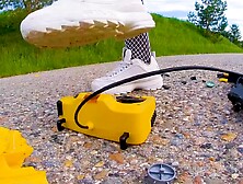 Large excavator is destroyed kicked, trampled, crushed, smashed, crushed, broken plastic car, crush