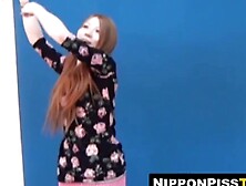 Asian newbie girl wets her shorts during solo photo session