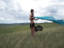 On Top Of A Hill In Windy Weather