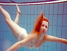 Cute Redhead Plays Naked Underwater