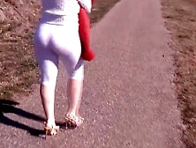 Long butts inside white pants.