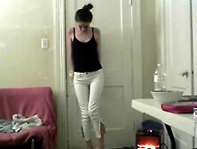 Slender Girl Holding Pee And Wetting White Jeans