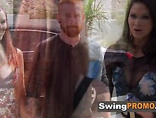 Redhead swinger sucks big cock at orgy