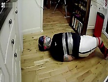 Footballer Tied And Taped Tight On Kitchen Floor Alternative View