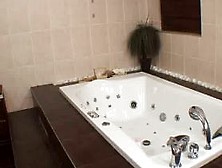 Hot european girl in bath uses shower head to masturbat