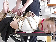 Slender Asian Girl With Sexy Legs Is Introduced To Bondage