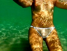 Hot Milf in transparent Bikini shows her cunt