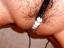 The girl tried on her new panties and got so carried away that she started rubbing her hairy pussy with them.