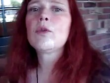 lovely redhead takes cum facial in public
