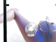 Riding transparent dildo on a glass table