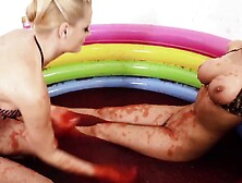 Cheerful Babes Play With Jello In The Pool And Finger Each Other