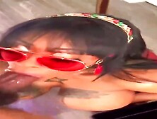 Kinky Ebony dark-haired is throating in front of the camera,  while getting down on all fours on the floor