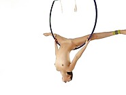 Brunette Kim Nadara in yellow socks doing acrobatics