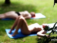 Two Naked Girls Sunbathing In The City Park