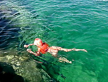 Blue water and a naked babe!