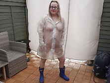 Naked Under Plastic Transparent Raincoat And Wellingtons Out In The Cold Outdoors