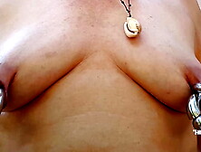 nippleringlover slutty mother pumping pierced boobies inserting large double rings in extreme pierced nipples outdoors