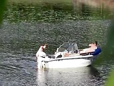 Nudist couple has fun in the middle of a beautiful lake
