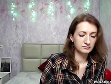 Brunette babe unbuttons her shirt