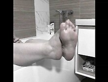 Older big bodied woman milf washes her plump feet.