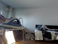 Home-made mom does chores in the naked house.