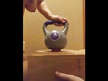 Wife crushes balls with kettle bells