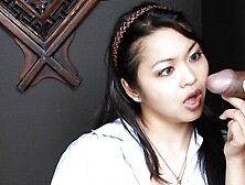 An awesome Asian brunette Mika Tan is sucking down on the knees