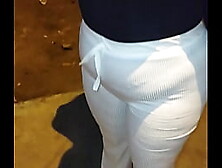 LARGE-BOOTY OLDER WITH RED THREAD ON THE STREET