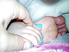 Amateur Feet With Bright Blue Painted Toenails