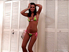 Enchanting Tramp In A Green Bikini With Pink Trim Dancing In The Bedroom.