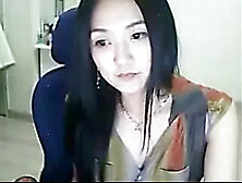 Adorable Asian babe smokes cigarette and demonstrates her boobs