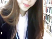 Riding red dildo on library