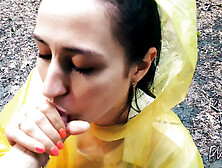 Nasty Brunette In A Yellow Raincoat Licks Me Outdoors In The Rain