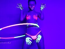 Dances And Hula Hoops Under A Black Light