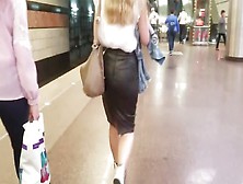 Woman's Ass In Leather Skirt