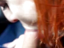 Redheaded Vixen Gives Road Head in Car - PornPros