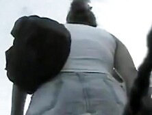 Fat babe's ass is filmed on the voyeur camera this noon