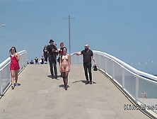 Naked in stockings at beach front