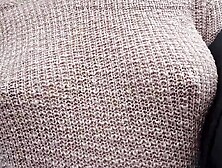 Boobwalk: Walking braless in a pink watch throughout knitted sweater