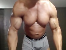 Huge Bodybuilder With Massive Biceps And Sweaty Pecs!