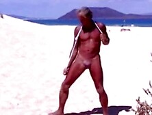 Beach Striptease: Tanned Hunk Bares All