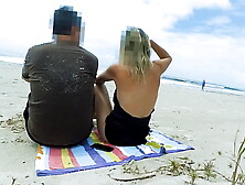 Filming an anal scene on the beach in front of passersby