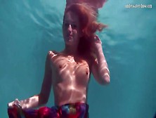 Redhead In A Pretty Dress Takes Us Underwater