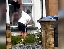 British women tits pop out while trying to climb into her house through her window