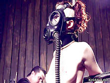 Masked Red-Haired Marionette In Tool Bondage