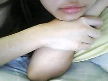 Chinese girl plays with tits