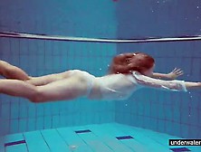 Cute Redhead Playing Naked Underwater