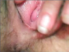 Closeup web cam shows a wife fingering her holes