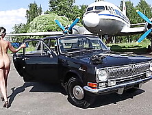 Soviet Plane,  Black Volga And Nude Model
