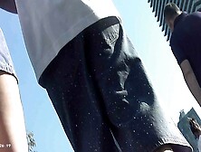 Upskirt - Sexy Brunette in Denim Skirt